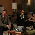 Image may contain Ed Helms Brian Markinson Linda Cardellini Couch Furniture Lamp Adult Person Table Lamp and Table