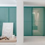 A Perforated Metal Box Hides the Bathroom in This Small Madrid Apartment