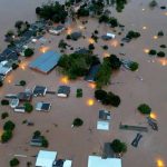 A drone view shows houses in the flooded area next to the Taquari River during heavy rains in the city of Encantado in Rio Grande do Sul, Brazil, May 1, 2024. — Reuters