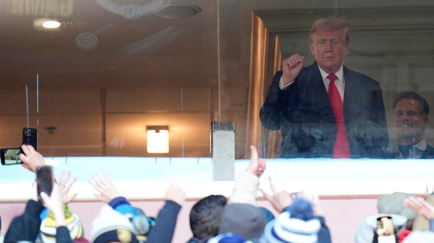 Trump saluting fans