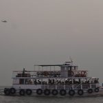 A military helicopter flies over a ferry during a rescue operation after a passenger boat capsized off the coast of Indias financial capital Mumbai, India, December 18, 2024. — Reuters