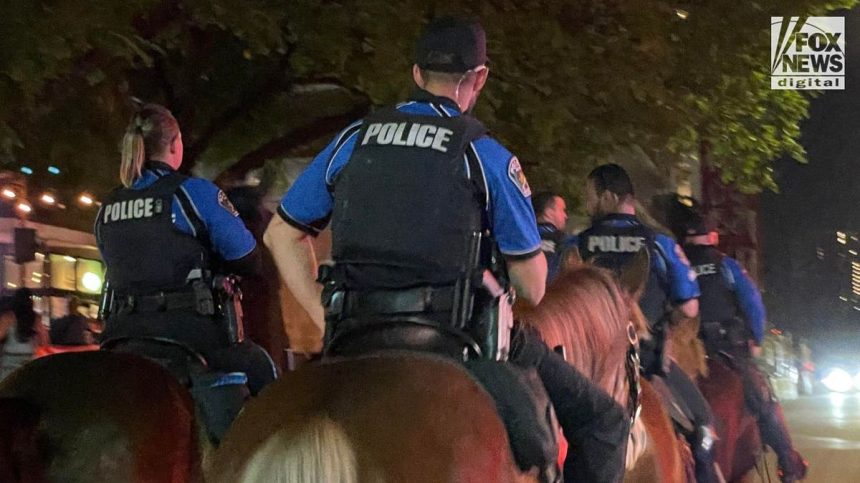 Mounted police patrolling down Rainey Street