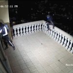 Thieves on a balcony breaking into house