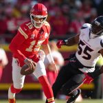 Patrick Mahomes runs past a player