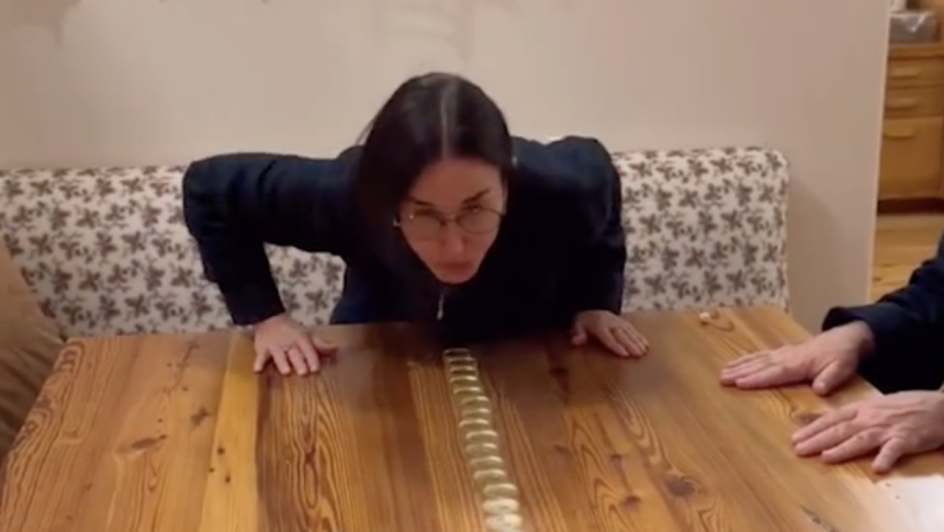 Demi Moore and daughters in stitches over viral Christmas candle challenge