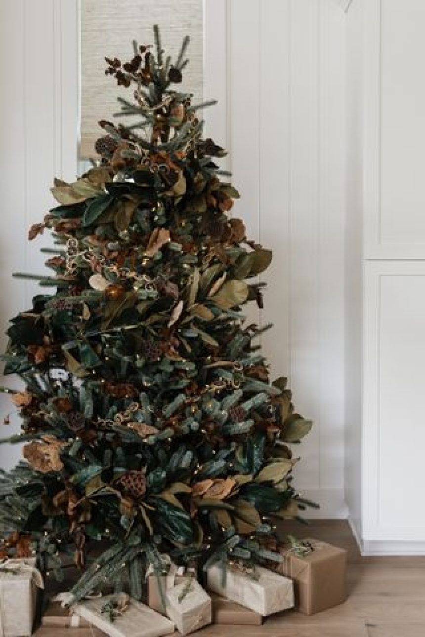 a christmas tree with foliage wrapped around