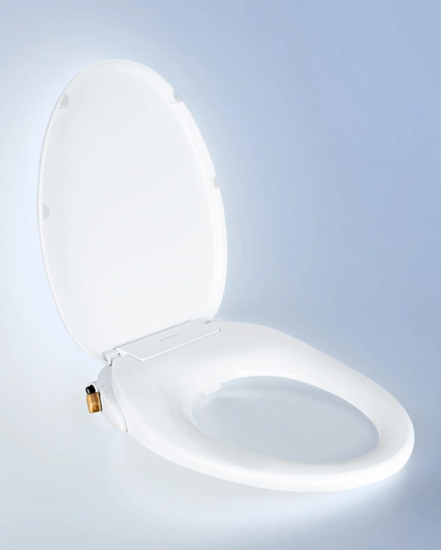 Tushy Wave non-electric bidet seat on a blue and white background