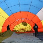 Participants prepare their hot air balloon during the international festival at Pokhara in Nepal on December 25, 2024. — AFP