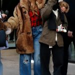 Image may contain Jennifer Lopez Clothing Pants Jeans Adult Person Footwear Shoe Coat Accessories and Glasses