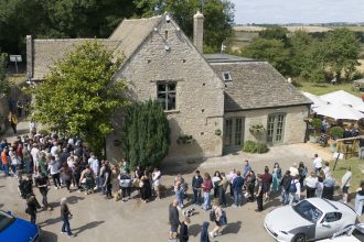 People queued outside The Farmer’s Dog on the day it reopened (Ben Birchall/PA)