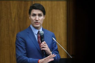 Canadas Prime Minister Justin Trudeau addresses the Liberal party caucus meeting in Ottawa