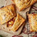 These cheesy, chutney-filled pasties are the perfect way to repurpose your festive cheeseboard into a warm, crumbly hug of flavour