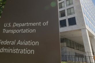 A sign marks the entrance to the FAA headquarters