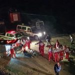 This handout picture provided by the Iranian Mizan News Agency on January 9, 2020 shows Iranian Red Crescent paramedics recovering bodies at the scene of a bus accident that plunged off a mountain road into a ravine in Mazandaran province. — AFP