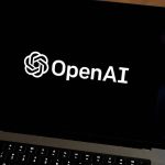 The OpenAI logo on a laptop