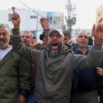 Mourners shout during the funeral of 19-year-old Rahbi Shalabi, who was killed during clashes between Palestinian security forces and militants a day earlier, in the occupied West Bank city of Jenin on Dec. 10, 2024.