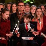 Princess Charlotte, Prince Louis and the Princess of Wales light candles during the Together at Christmas carol service (Aaron Chown/PA)