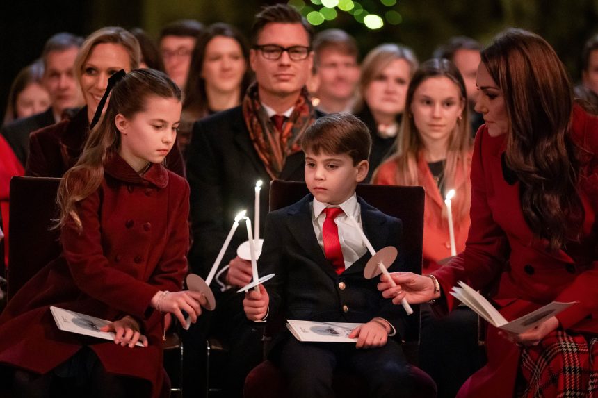 Princess Charlotte, Prince Louis and the Princess of Wales light candles during the Together at Christmas carol service (Aaron Chown/PA)