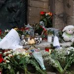 Floral tributes are left by a church near the site where a car drove into a crowd at a Magdeburg Christmas market in Magdeburg, Germany December 21, 2024. — Reuters