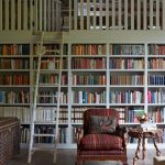 Image may contain Furniture Chair Bookcase Indoors Room Library Book Shelf Living Room and Rug