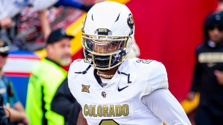 Shedeur Sanders jogs onto the field