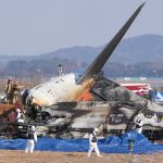 South Korea plane crash aftermath with rescue team