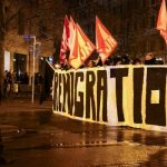 Police officers line up as far-right demonstrators hold a sign and flags during a protest after a car drove into a crowd at a Christmas market, in Magdeburg, Germany December 21, 2024. — Reuters