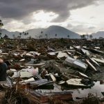 An Acehnese man among the ruins in Banda Aceh, on January 13, 2005, weeks after the 2004 Indian Ocean tsunami. — AFP/File