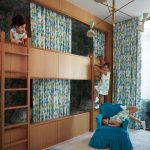 Image may contain Child Person Clothing Footwear Shoe Furniture Bed Bedroom Indoors Room and Bunk Bed