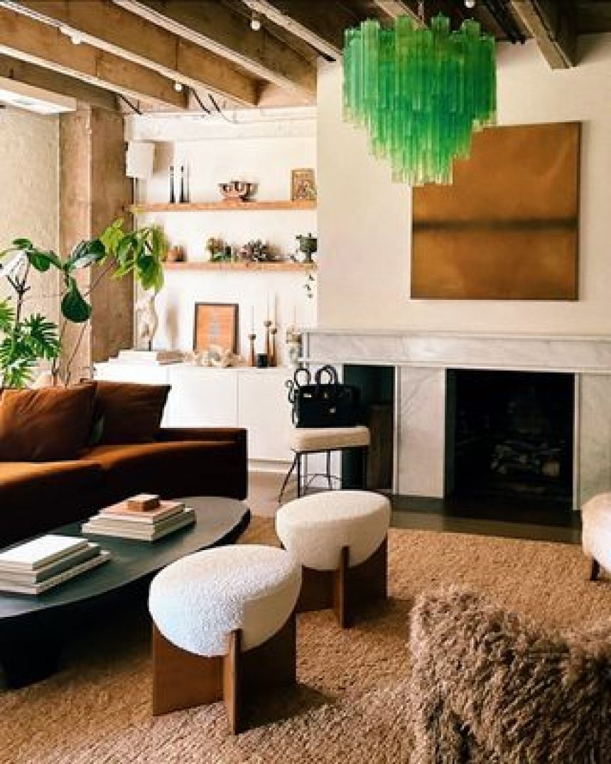 a neutral living room with a bright green murano glass chandelier