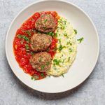 A festive twist on comfort food – these turkey meatballs pair perfectly with creamy polenta and a rich, tangy tomato sauce