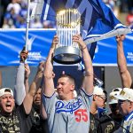 Walker Buehler raises World Series trophy