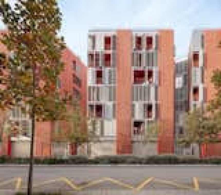 Barcelona firms MIAS Architects and Coll-Leclerc completed 72 social housing units in the Marina del Prat Vermell neighborhood in 2023. The facade features alternating vertical strips of glass and ribbed fiber-reinforced concrete. The triangular building’s openings are designed to maximize solar gain in winter and provide solar shading and cross ventilation in summer on all floors. 