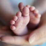 A representational image of a babys feet being held by a woman. — AFP/File