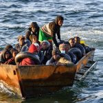 Representational image of migrants from sub-Saharan Africa sit in a makeshift boat off the coast of Tunisias city of Sfax on October 4, 2022. — AFP