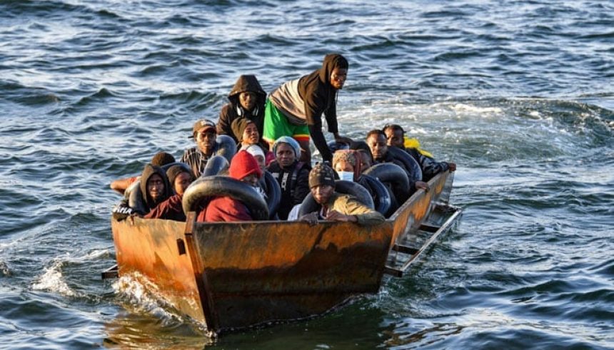 Representational image of migrants from sub-Saharan Africa sit in a makeshift boat off the coast of Tunisias city of Sfax on October 4, 2022. — AFP