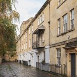 Image may contain City Road Street Urban Architecture Building Housing Alley Plant and House