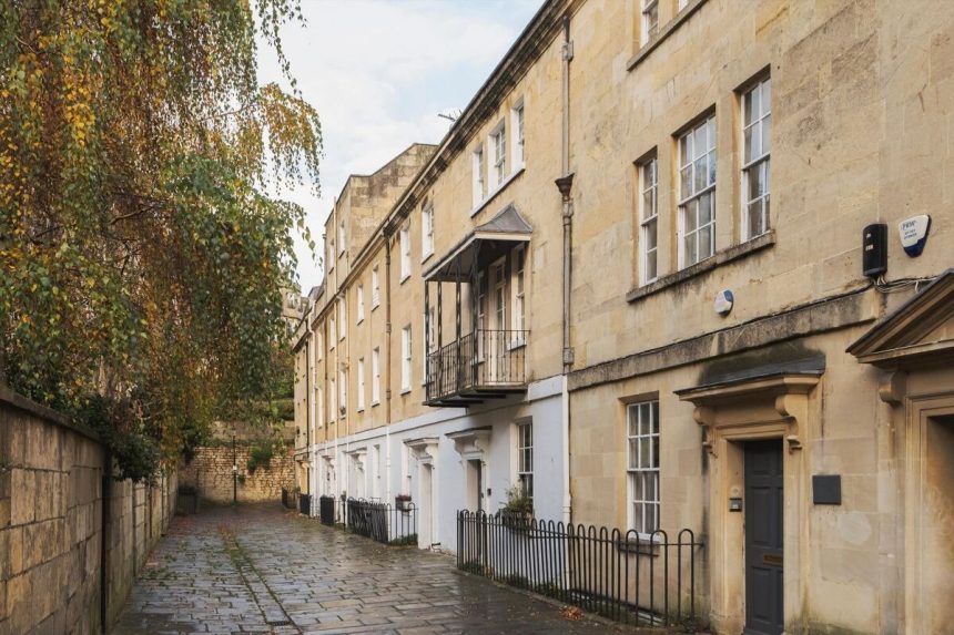 Image may contain City Road Street Urban Architecture Building Housing Alley Plant and House