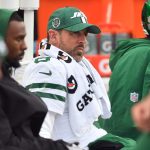 Aaron Rodgers sits on bench