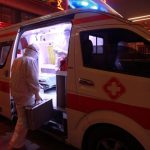 A medical worker in protective suit gets into an ambulance at a hospital in Xuanhua district of Zhangjiakou, Hebei province, China February 13, 2020. — Reuters