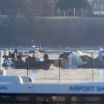 Emergency response units search the crash site of the American Airlines plane on the Potomac River