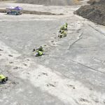 Workers gather around five extensive trackways that formed part of a "dinosaur highway" at Dewars Farm Quarry in Oxfordshire, England.