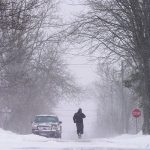 A person walks down a street during a winter storm in Souris, Prince Edward Island, Canada, January 6, 2025. — Reuters