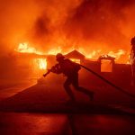 Firefighter battles a fire