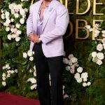 Dwayne Johnson in a lilac suit outside the 2025 Golden Globes