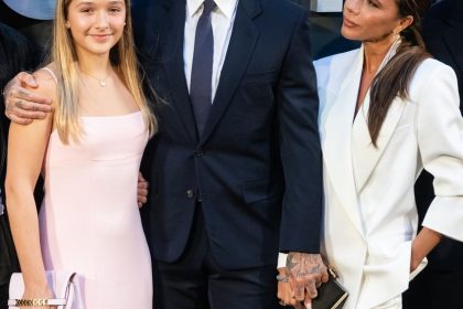 Harper Beckham and David Beckham smile at camera