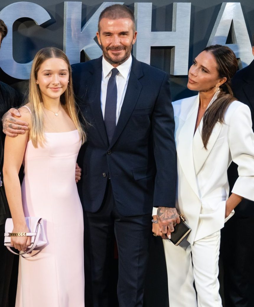 Harper Beckham and David Beckham smile at camera