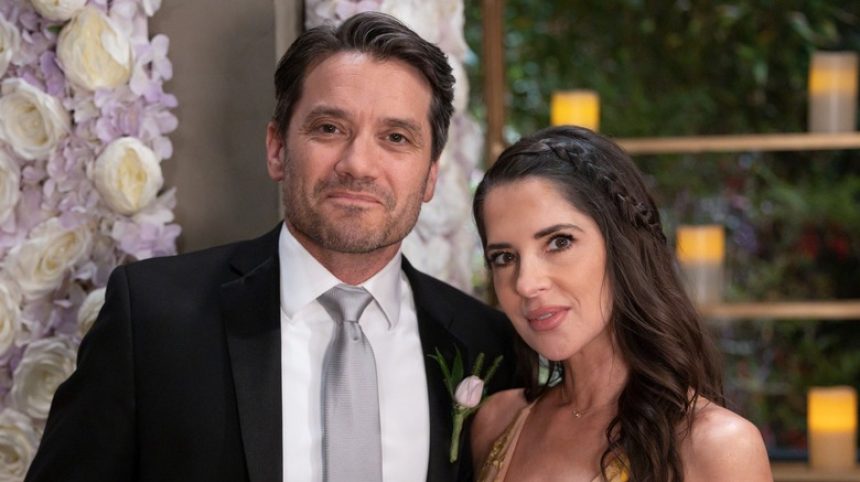 Dominic Zamprogna and Kelly Monaco smiling on the set of General Hospital