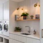 laundry room with wall lights switched on