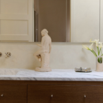 Marble bathroom countertop with cream statue